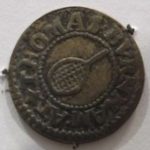 Bronze trade token depicting a tennis racket