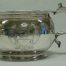 Shiny silver chamberpot engraved with the royal coat of arms