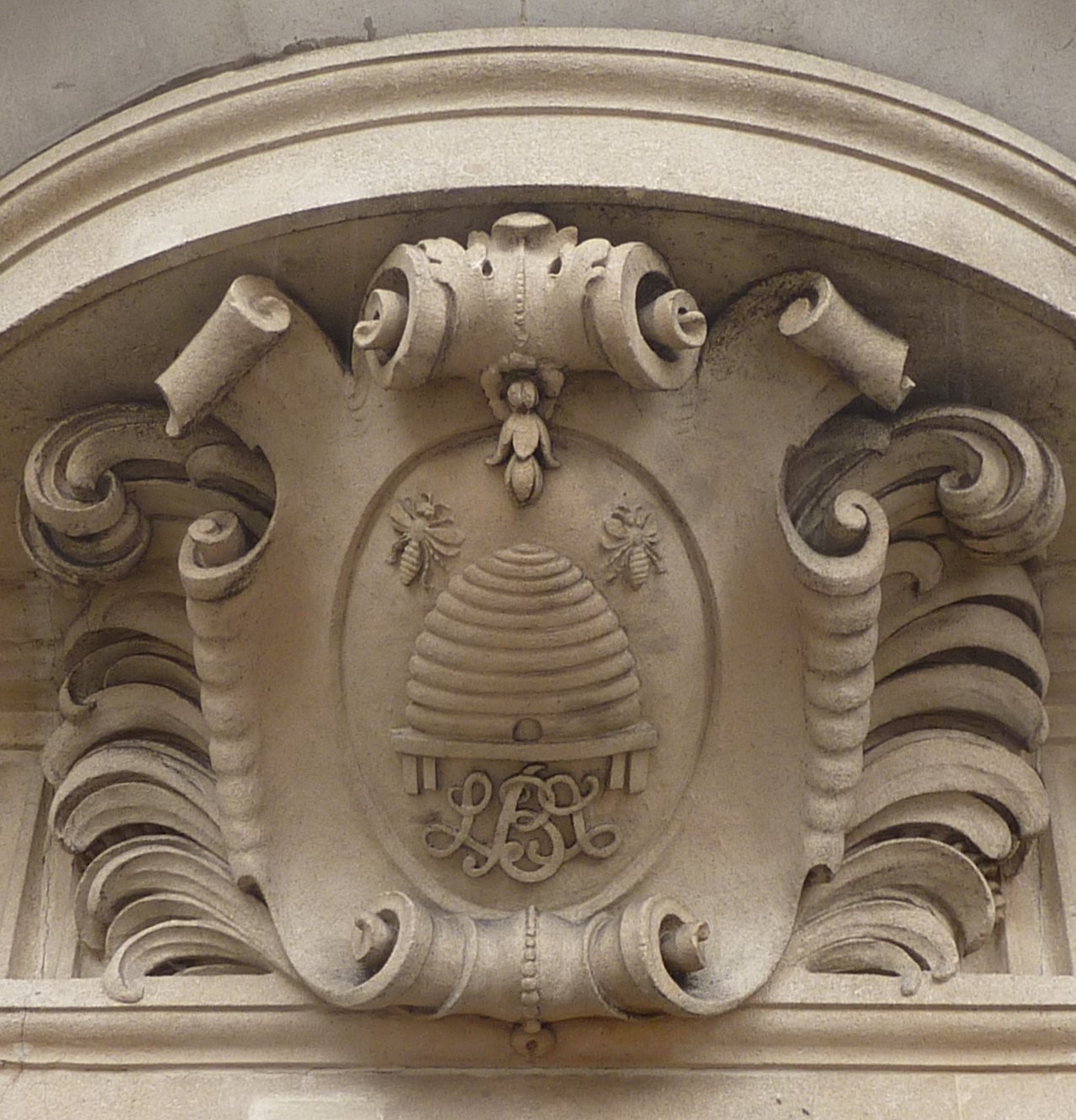 Beehive carved in stone in building above door