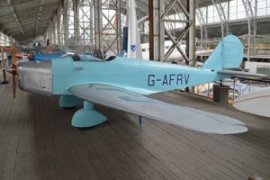photograph of second world war propeller plane in a museum