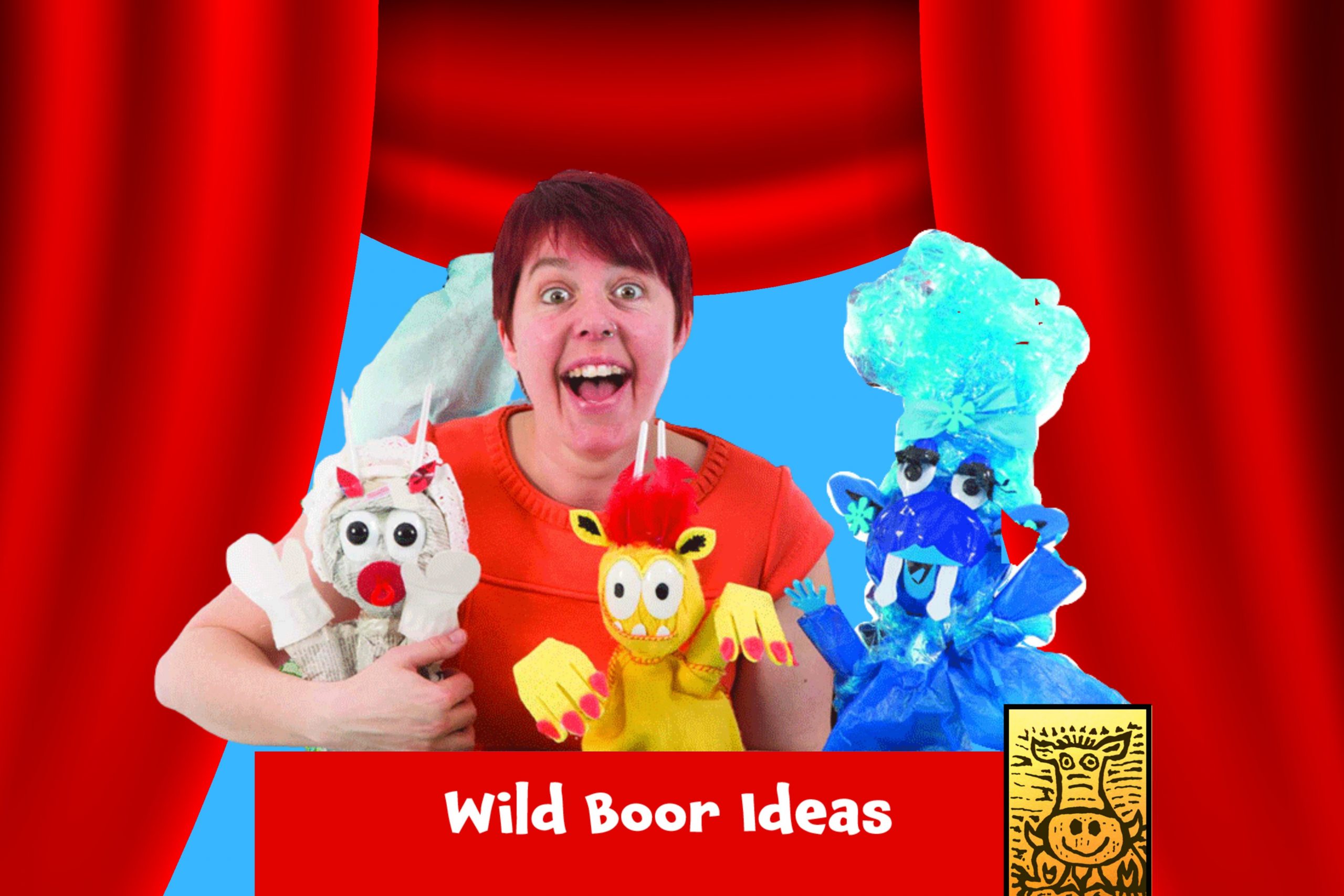 Red cartoon curtains over a blue background. A woman with short hair stands in the centre, surrounded by puppets made of recycled materials. The group name and logo 'Wild Boor Ideas' is below.