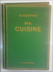 a book with a green cover with the writing A. Escoffier Ma Cuisine printed on the front