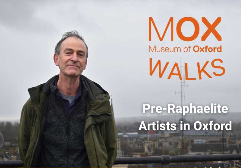 Mark Davies stands against the Oxford skyline on a grey day. Text displayed next to him reads 'Museum of Oxford Walks: Pre-Raphaelite Artists in Oxford'.
