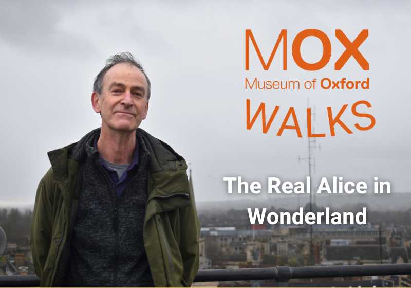 Mark Davies stands against the Oxford skyline on a grey day. Next to him, text reads: 'Museum of Oxford Walks: The Real Alice in Wonderland'